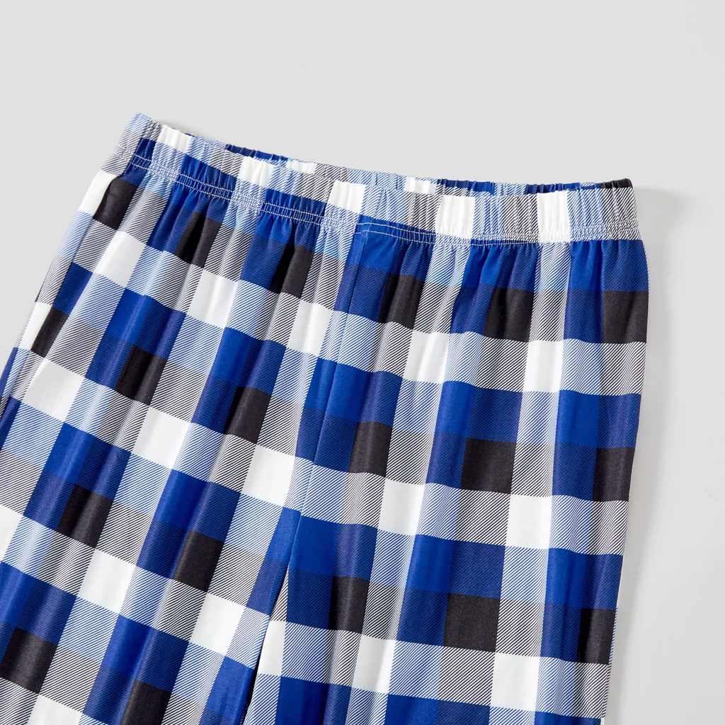 Couple Matching Blue Plaid Pajamas With "2025 Family Christmas" Text Printed